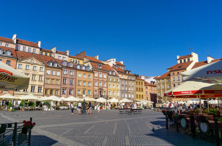 Warsaw's main square with restaurants, on a sunny day.のeditorial素材