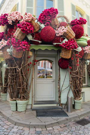 Vilnius city bar. Door decorated with many flowers of pink tones.のeditorial素材