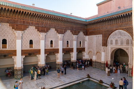 Main courtyard of the Ben Youssef Madrasa seen from above, full of tourists.のeditorial素材