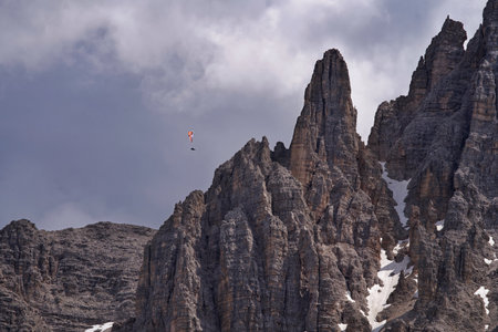 Paraglider in the Dolomites mountains, Italy.の写真素材