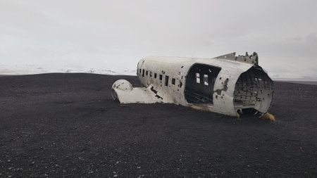 Abandoned airplane wreck on the black volcanic sand of Iceland.