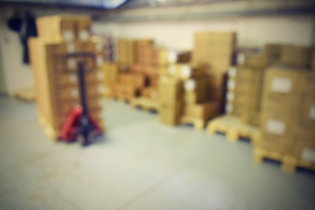 Blurred background warehouse. Abstract blurry warehouse storing. Pallet truck.の写真素材