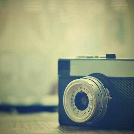 Russian old analog camera on a wooden deskの写真素材