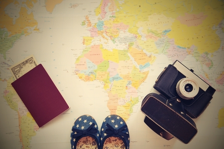 Beautiful concept for summer travel. Map with sunset and accessories for vacation planning.