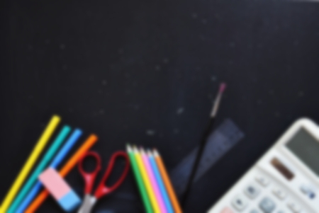 Background back to school. Blackboard with school aids.