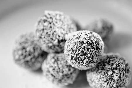 Homemade coconut rum balls on plate. Christmas sweets. Traditional homemade handmade Czech sweets.