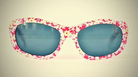 Sunglasses. Baby, pink-white colorful glasses isolated on a clean white background.の写真素材