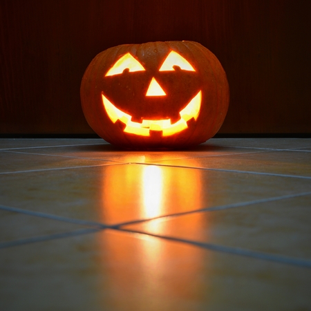 Halloween pumpkin lantern with black backgroundの写真素材