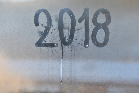 New Year 2018 written on the misty glassの写真素材