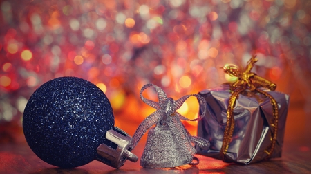 Christmas decorations. Beautiful Christmas tree ornaments on abstract, blurred colorful background....