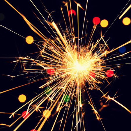 Sparkler with beautiful abstract colorful background. Concept for Christmas and Happy New Year 2021.の写真素材
