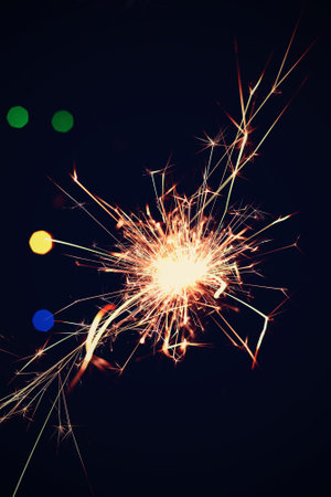 Sparkler with beautiful abstract colorful background. Concept for Christmas and Happy New Year 2021.の写真素材