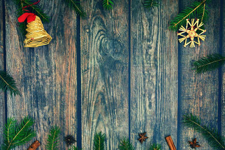 Christmas background with decorations on a brown wooden background. Flat lay, top view with copy space.の写真素材