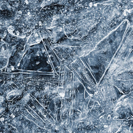 Frozen pool of water in winter. Ice nature - macro shot of frozen water.