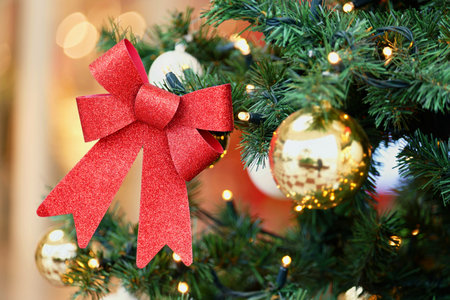 Beautifully decorated Christmas tree with blurred background. Concept for Christmas holidays and winter season.の写真素材