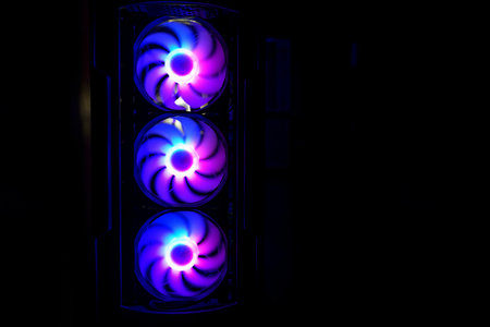 Computer cooler with RGB LED light. Computer circuit board and CPU cooling fans illuminatedの写真素材