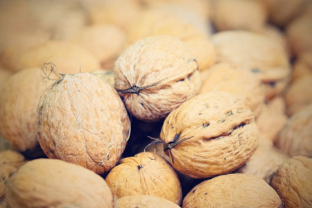 Walnuts on the market, close-up. Selective focus.の写真素材