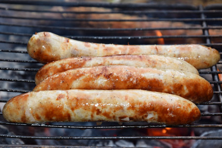 grilled sausages on the grill, closeup of photoの写真素材