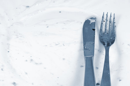 Fork and knife on white background. Shallow depth of field. No: D.の写真素材