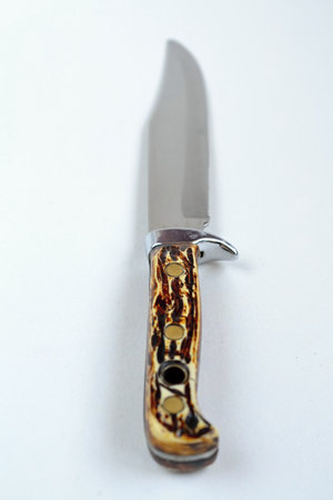 hunting knife on a white background, isolate, close-up