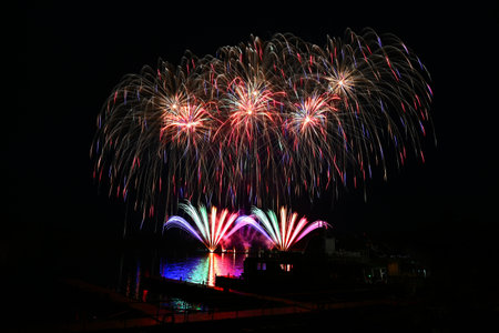 Beautiful colorful fireworks with reflections in water. Brno dam, the city of Brno-Europe....