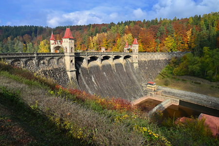 Beautiful old dam Les Kralovstvi - Czech Republic. Autumn background with colorful trees. Nature with landscape. Seasonal concept for fall.の写真素材