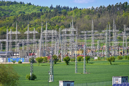 Electric power poles. Power plant - current distribution station. Concept for industry and...