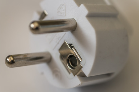white electric plug  on white background