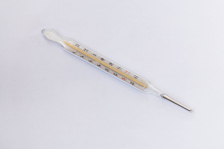Mercury thermometer on white background