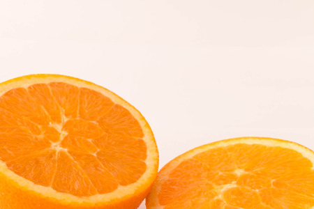 pieces of orange on a white background close-upの写真素材