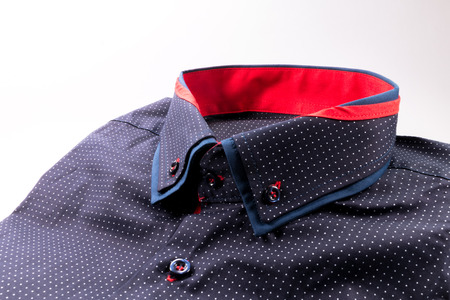 blue men's shirt with white spots on white backgroundの写真素材
