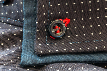 blue men's shirt with white spots on white backgroundの写真素材