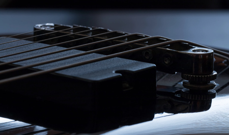 Black electric guitar detail close-up