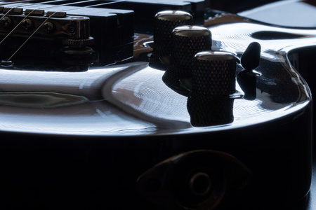 Black electric guitar detail close-upの写真素材