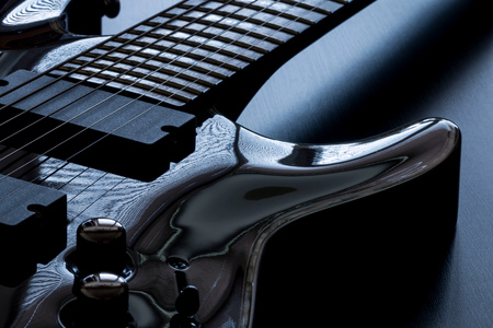 Black electric guitar detail close-upの写真素材