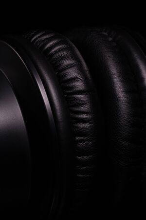 Beautiful details of professional studio headphones close-up on a black backgroundの写真素材