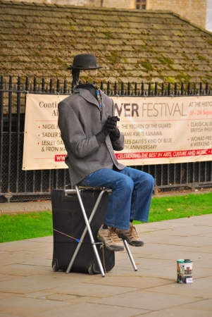 A street artist poses as a human statue without head in London, United Kingdom, August 24, 2009