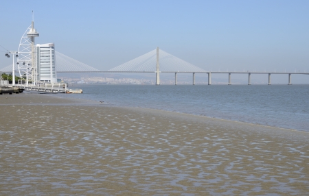 The Vasco da Gama Tower  built over the Tagus river and  Bridge with the same name, that  is the longest bridge in Europe. They are located in the Park of the Nations in Lisbon, Portugal.のeditorial素材