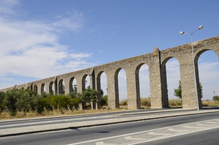 The Agua de Prata Aqueduct was constructed in the sixteenth century in Evora, Portugal      integrating itself over subsequent centuries to become a part of the town の写真素材