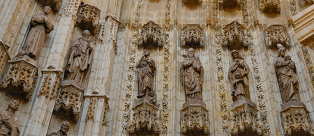 Detail of the door arch at the Cathedral of Saint Mary of the See, better known as Seville Cathedral in Seville (Andalusia, Spain). It is the largest Gothic cathedral and the third-largest church in the world.の写真素材