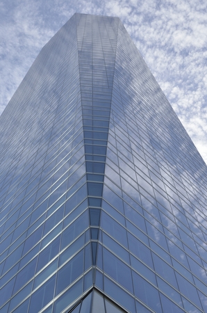Clouds reflected in the Crystal Tower in the Four Towers Business Area, Madrid, Spain.  
The Crystal...