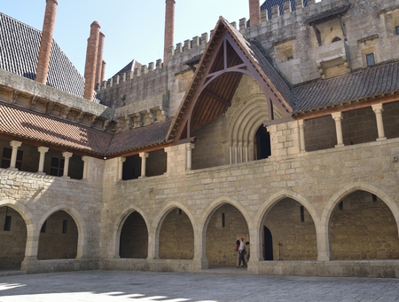 Some people at the corridor of  an inner patio of  Palace of the Dukes of Braganza,   in the northern region of Portugal.のeditorial素材