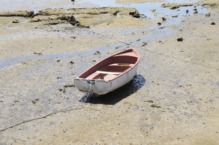 Fishing boat on the shore at the Ria of Pontevedra in the village of Aldan, Galicia, Spainの写真素材