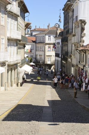 People at a commercial street in Valenca in Portugal.のeditorial素材