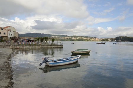 People in a plaza of the village of Combarro in the  province of Pontevedra in the Galicia region of Spain.のeditorial素材