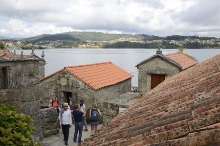 People in the streets of  Combarro, a village of the  province of Pontevedra in the Galicia region of Spain.のeditorial素材