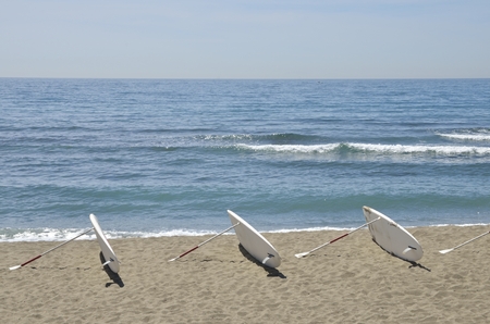 Surf tables at the shore of the beach in Marbella, Spainの写真素材