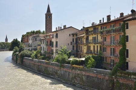 Buildings at the riverbanks of the Adige River in Verona, Italy.のeditorial素材