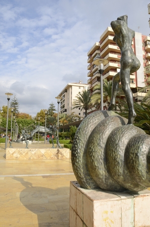 Back of Sculpture of Woman climbing the stairs, designed by Dali in Avenue of the sea, Marbella, Andalusia, Spainのeditorial素材