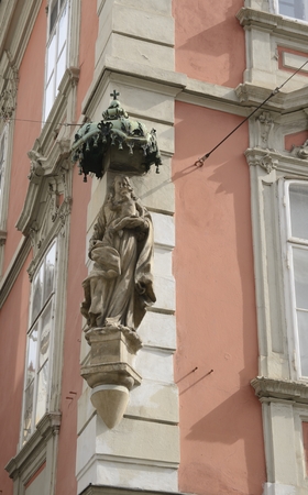 Sculpture of Virgin Mary with  Jesus on facade of building in Graz, the capital of Styria.のeditorial素材